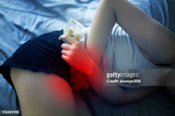 female feel hurt and pain on period - period blood stockfoto's en -beelden
