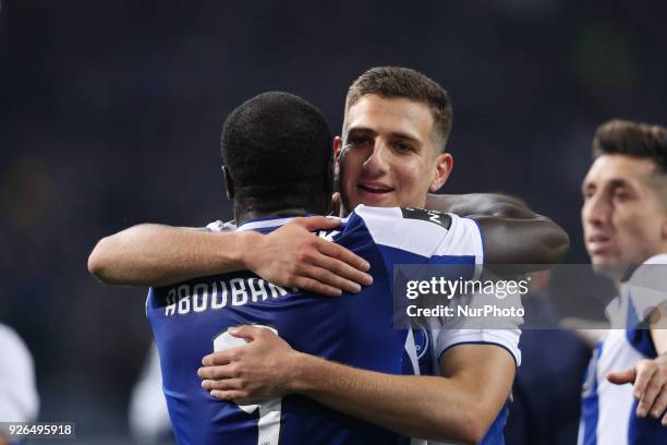 Porto's Cameroonian forward Vincent Aboubakar and Porto's Portuguese defender Diogo Dalot celebrates the victory in the game during the Premier...