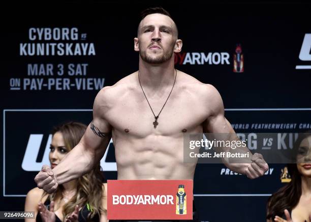 Adam Milstead poses on the scale during a UFC 222 weigh-in on March 2, 2018 in Las Vegas, Nevada.