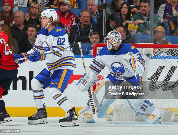 Nathan Beaulieu and Chad Johnson of the Buffalo Sabres defend against the Washington Capitals during an NHL game on February 19, 2018 at KeyBank...