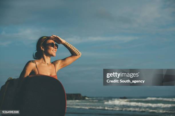 woman with red surfboard - asian swimsuit models stock pictures, royalty-free photos & images