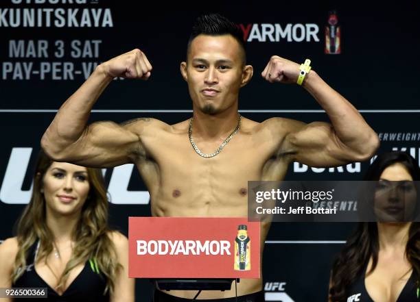 Andre Soukhamthath poses on the scale during a UFC 222 weigh-in on March 2, 2018 in Las Vegas, Nevada.