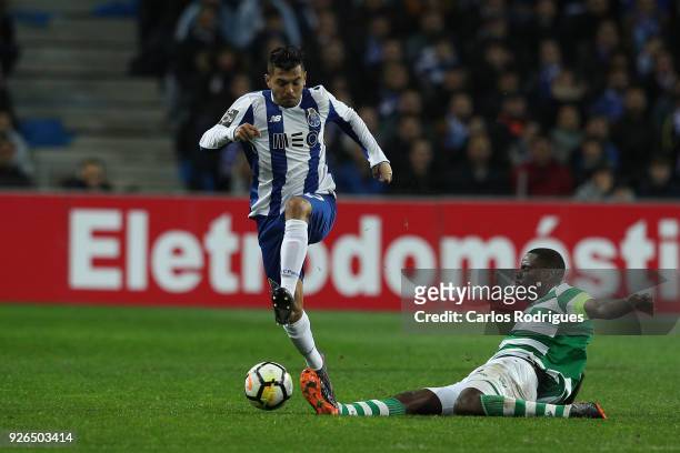 Porto forward Jesus Corona from Mexico vies with Sporting CP midfielder William Carvalho from Portugal for the ball possession during the Portuguese...