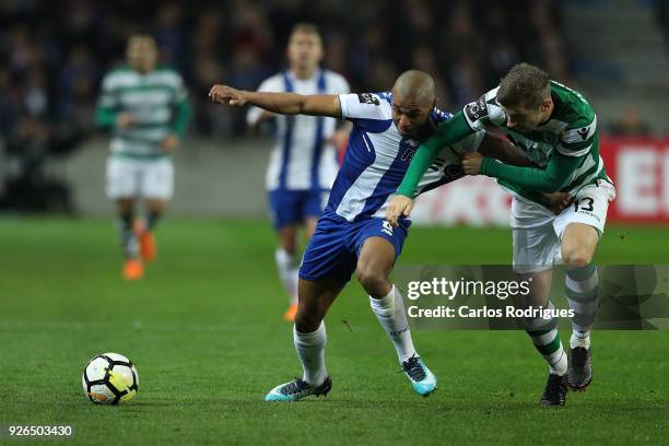 Porto forward Yacine Brahimi from Algeria vies with Sporting CP defender Stefan Ristovki from Macedonia for the ball possession during the Portuguese...