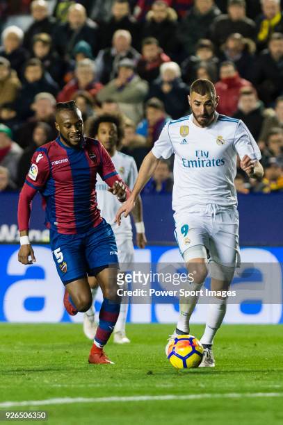 Karim Benzema of Real Madrid fights for the ball with Cheik Doukoure of Levante UD during the La Liga 2017-18 match between Levante UD and Real...