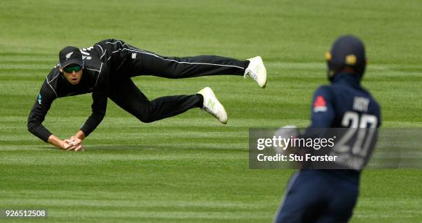 New Zealand fielder Mitchell Santner fields a ball from a Jason Roy shot during the 3rd ODI between New Zealand and England at Westpac stadium on...