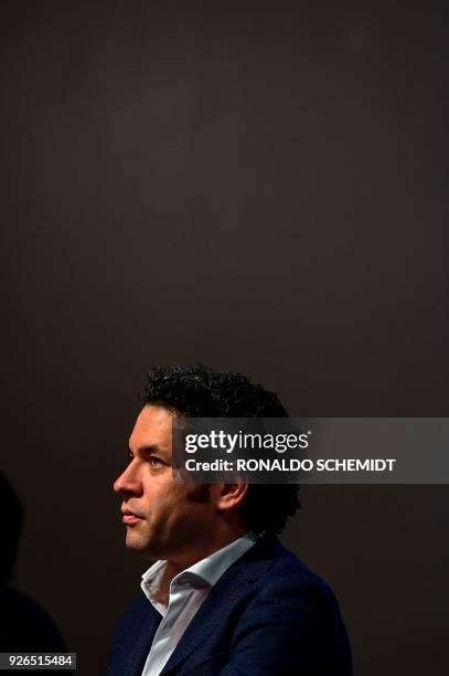 Venezulean conductor Gustavo Dudamel attends a press conference at the Fine Arts Palace, in Mexico city, on March 1, 2018. - Dudamel is in Mexico to...