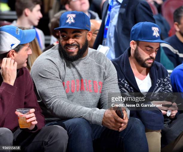 Brandon Graham of the Philadelphia Eagles looks on during the game between the Philadelphia 76ers and the Charlotte Hornets on March 2, 2018 at the...