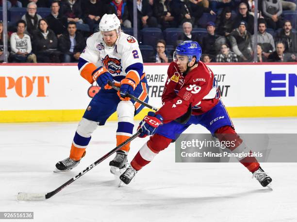 Jordan Boucher of the Laval Rocket skates against Seth Helgeson of the Bridgeport Sound Tigers during the AHL game at Place Bell on March 2, 2018 in...