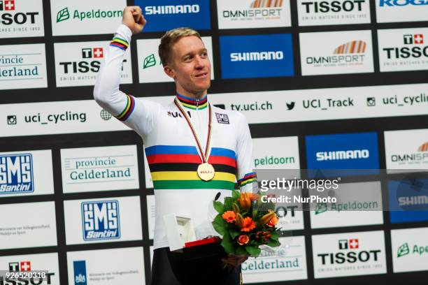 Gold medalist Australian Cameron Meyer poses on the podium after the men's points race final during the UCI Track Cycling World Championships in...