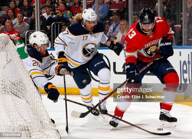 Mark Pysyk of the Florida Panthers tangles with Scott Wilson and teammate Jordan Nolan of the Buffalo Sabres at the BB&T Center on March 2, 2018 in...