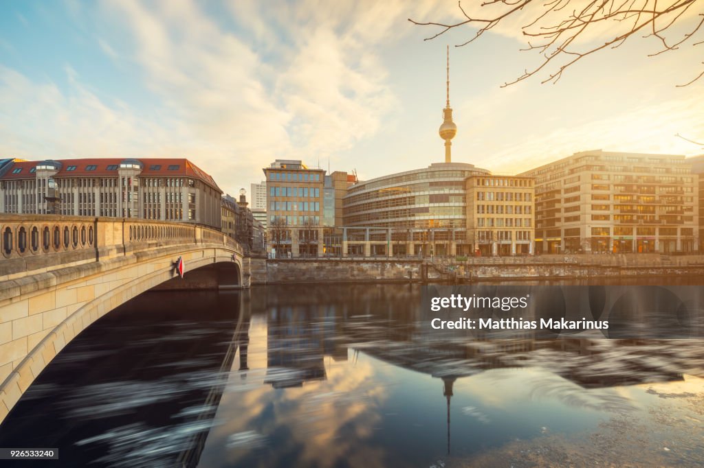 Berlin City Winter Skyline with Spree River Reflection and Sunlight