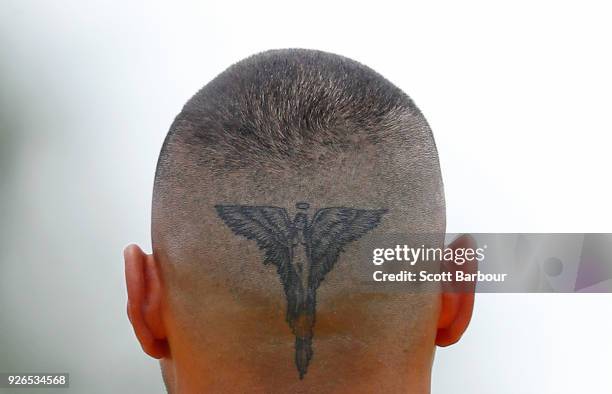 Detail of the tattoo on the back of the head of Jarman Impey of the Hawks during the AFL JLT Community Series match between the Western Bulldogs and...