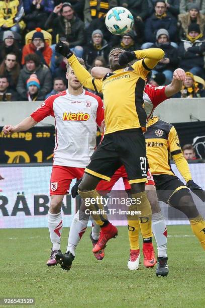 Moussa Kone of Dresden and Sebastian Nachreiner of Regensburg battle for the ball during the Second Bundesliga match between SG Dynamo Dresden and...