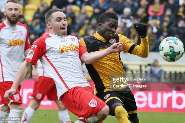 Andreas Geipl of Regensburg and Moussa Kone of Dresden battle for the ball during the Second Bundesliga match between SG Dynamo Dresden and SSV Jahn...