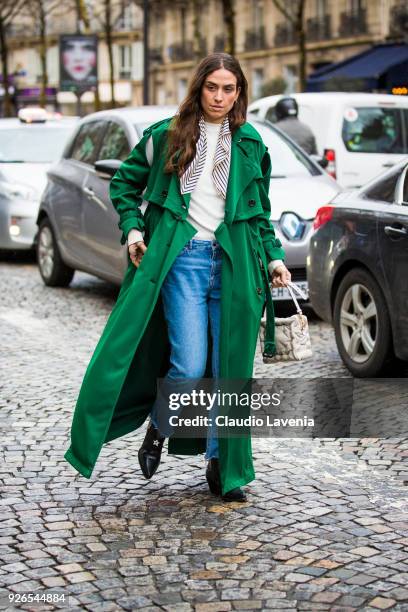 Erika Boldrin, wearing green trench and white bag, is seen in the streets of Paris after the Nina Ricci show during Paris Fashion Week Womenswear...