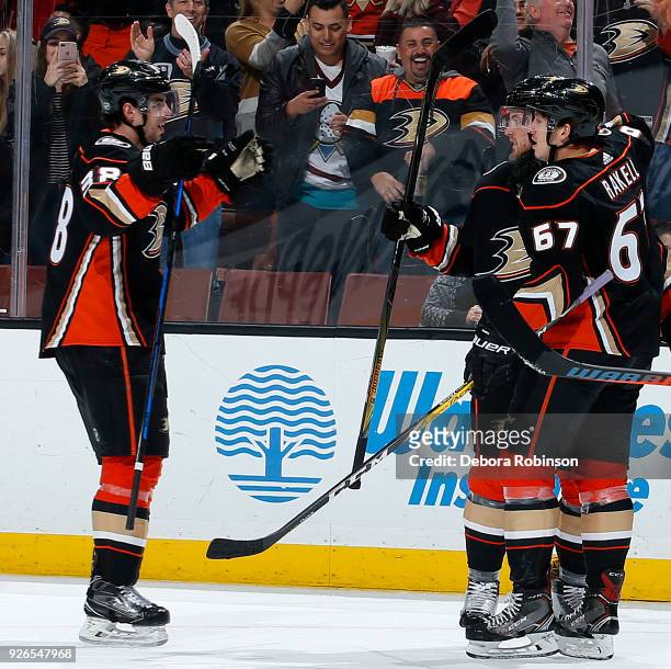 Derek Grant, Cam Fowler, and Rickard Rakell of the Anaheim Ducks celebrate Rakell's first period goal during the game against the Columbus Blue...