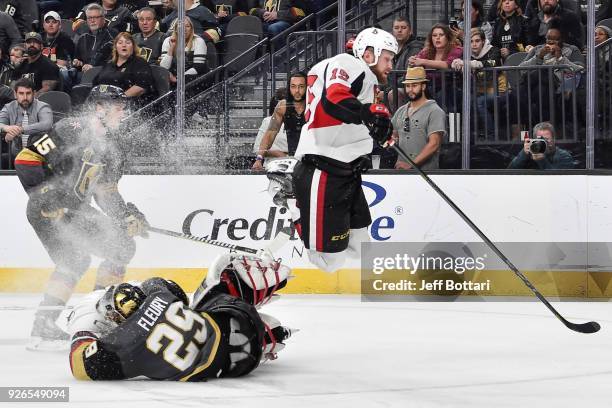 Zack Smith of the Ottawa Senators collides with Marc-Andre Fleury of the Vegas Golden Knights during the game at T-Mobile Arena on March 2, 2018 in...