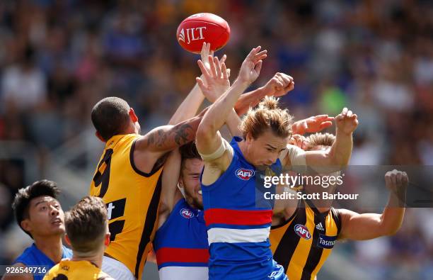 Mitch Honeychurch of the Bulldogs competes for the ball during the AFL JLT Community Series match between the Western Bulldogs and the Hawthorn Hawks...