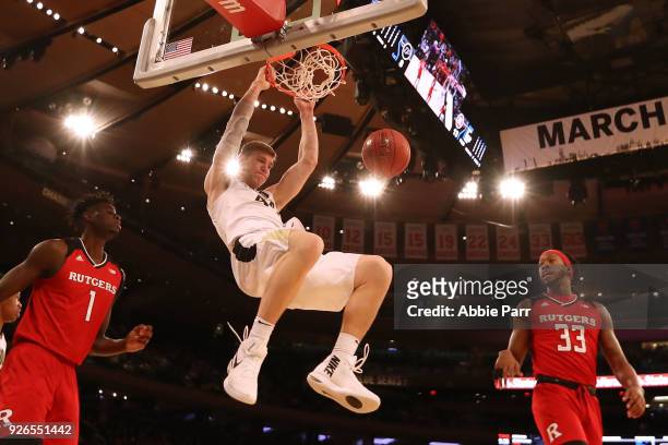 Isaac Haas of the Purdue Boilermakers dunks the ball in the first half against the Rutgers Scarlet Knights during quarterfinals of the Big Ten...