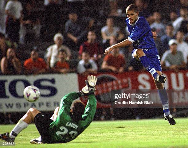 Vaughan Coveny for South Melbourne drives the third goal past Simon Eaddy, goalkeeper for Auckland, during the match between South Melbourne and the...