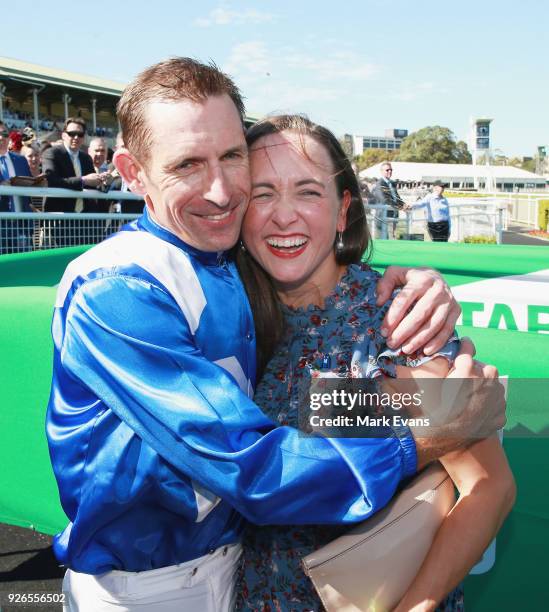 Hugh Bowman hugs wife Christine after winning race 6 riding Winx in The Chipping Norton Stakes during Sydney Racing at Royal Randwick Racecourse on...