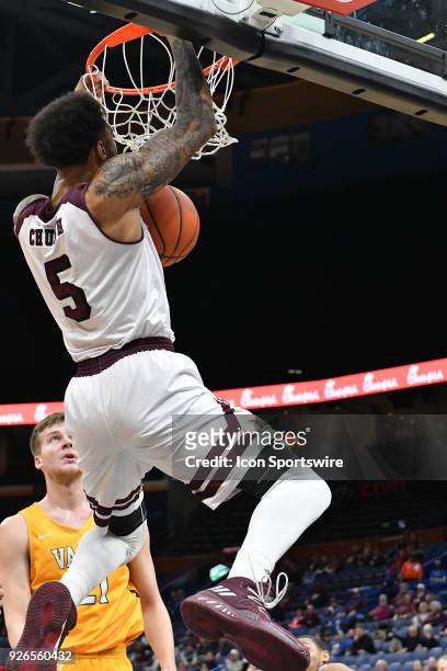 Missouri State forward Obediah Church dunks in the first half during a Missouri Valley Conference Basketball Tournament game between the Missouri...