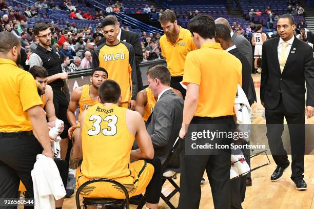 Valparaiso basketball coach Matt Lottich talks to his team during a time out during a Missouri Valley Conference Basketball Tournament game between...