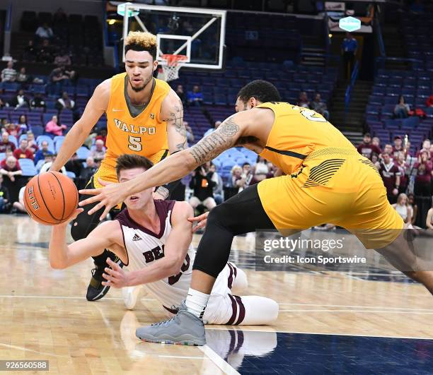 Missouri State guard Ryan Kreklow falls to the court while passing the ball during a Missouri Valley Conference Basketball Tournament game between...