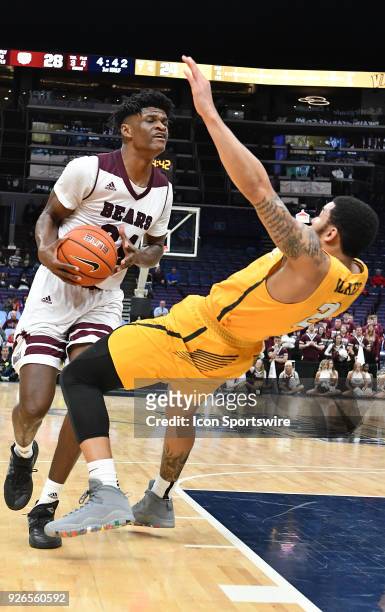 Valparaiso guard Tevonn Walker commits a blocking foul against Missouri State forward Alize Johnson during a Missouri Valley Conference Basketball...