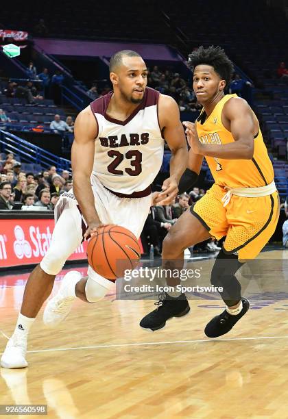 Missouri State guard J.T. Miller drives for the basket during a Missouri Valley Conference Basketball Tournament game between the Missouri State...