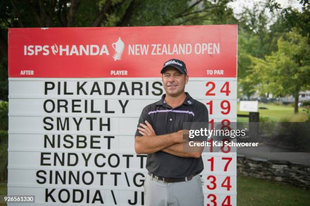 Terry Pilkadaris of Australia poses in front of the leaderboard during day three of the ISPS Handa New Zealand Golf Open at Millbrook Golf Resort on...