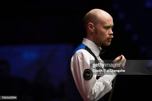 Gary Wilson of England chalks the cue during his quarter-final match against Yu Delu of China on day five of 2018 ManBetX Welsh Open at Motorpoint...