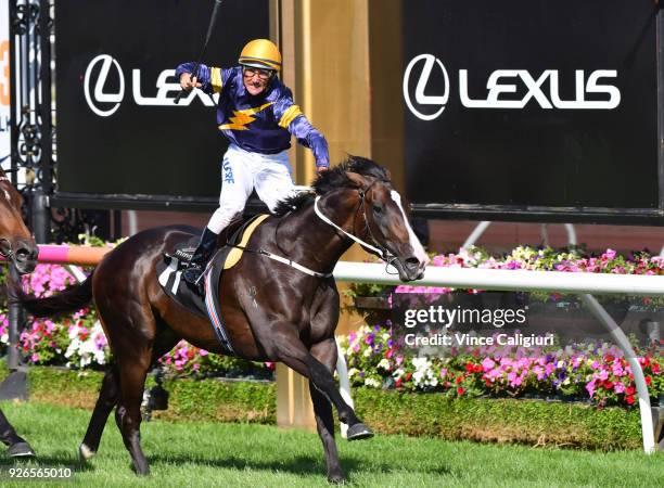 Damien Oliver riding Grunt reacts on the post to win Race 7, Australian Guineas during Melbourne Racing at Flemington Racecourse on March 3, 2018 in...