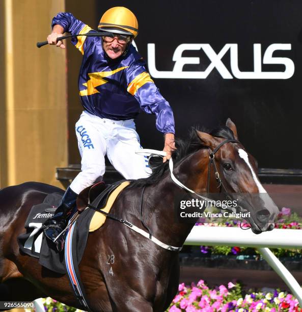 Damien Oliver riding Grunt reacts on the post to win Race 7, Australian Guineas during Melbourne Racing at Flemington Racecourse on March 3, 2018 in...