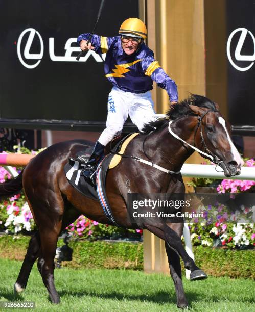 Damien Oliver riding Grunt reacts on the post to win Race 7, Australian Guineas during Melbourne Racing at Flemington Racecourse on March 3, 2018 in...