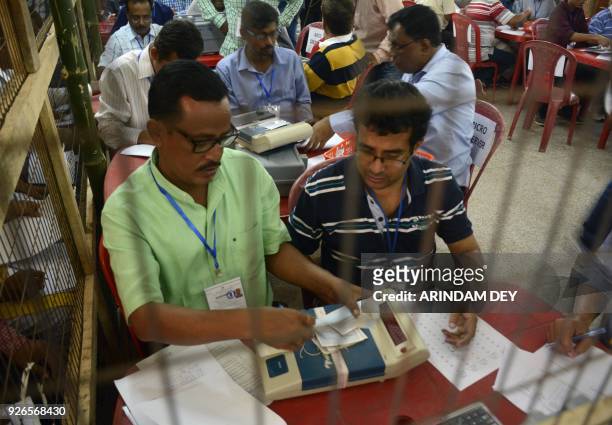 Indian election officials tally votes in a counting hall for the Tripura legislative assembly election in Agartala, the capital of the northeastern...