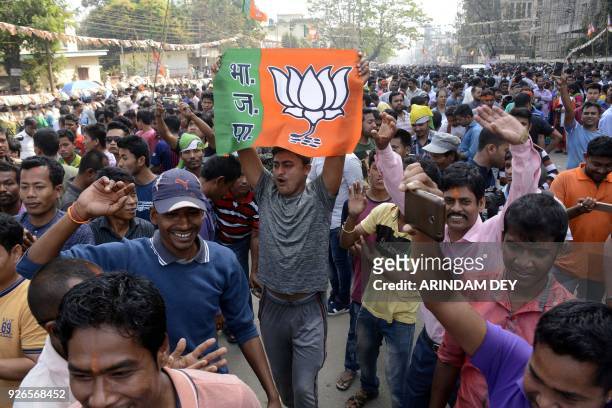 Indian supporters of the Bharatiya Janata Party celebrates at a rally as voting was underway for the Tripura legislative assembly election in...