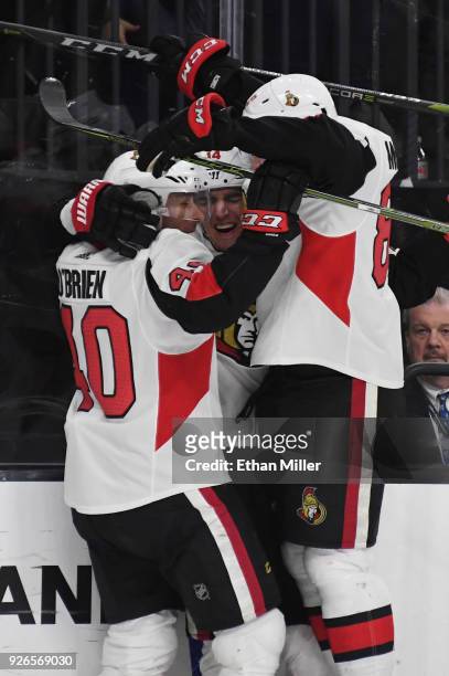 Jim O'Brien, Alexandre Burrows and Max McCormick of the Ottawa Senators celebrate after Burrows scored a third-period goal against the Vegas Golden...