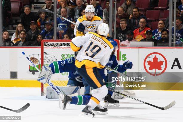 Calle Jarnkrok of the Nashville Predators scores a goal against Jacob Markstrom of the Vancouver Canucks during their NHL game at Rogers Arena on...