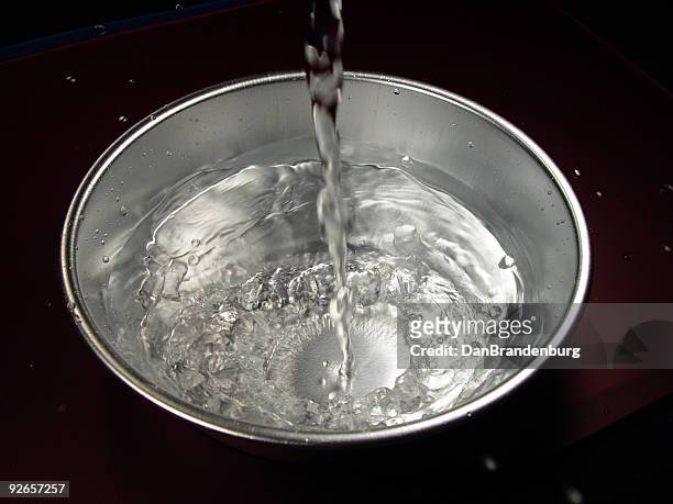 pouring water - cooking pan stock pictures, royalty-free photos & images