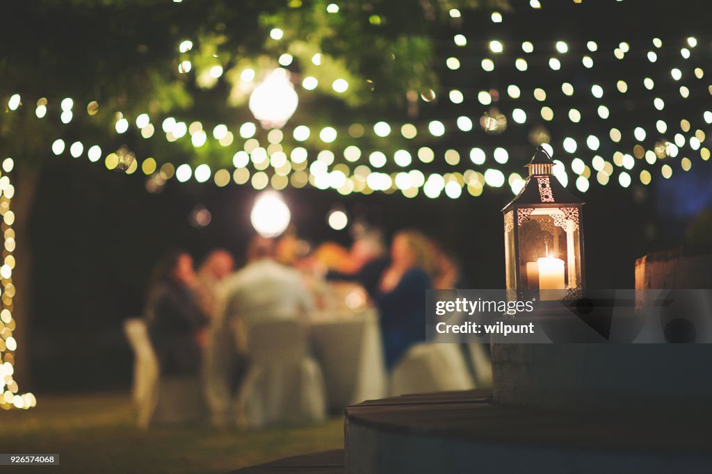 Candle and string lights outdoor dinner