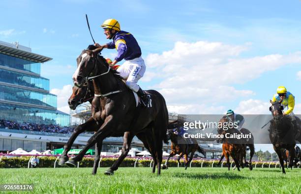 Damien Oliver riding Grunt reacts on the post to win Race 7, Australian Guineas during Melbourne Racing at Flemington Racecourse on March 3, 2018 in...