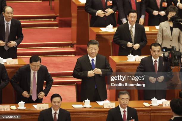 Zhang Dejiang, chairman of the Standing Committee of the National People's Congress, left, Xi Jinping, China's president, center, and Li Keqiang,...