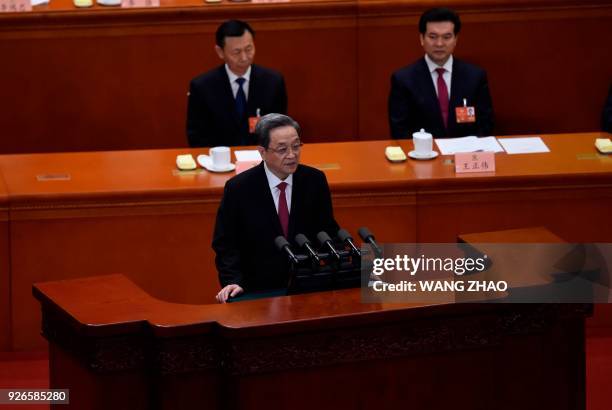 Yu Zhengsheng, Chairman of the National Committee of the Chinese People's Political Consultative Conference , delivers his report during the opening...