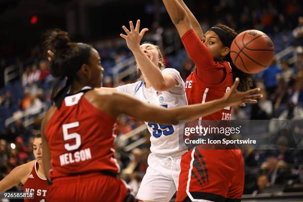 Duke Blue Devils forward/center Erin Mathias loses the ball underneath the basket during the ACC women's tournament game between the NC State...