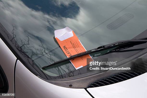 silver car that has a parking ticket - parking ticket stock pictures, royalty-free photos & images