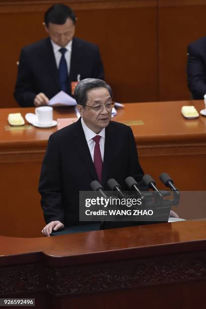 Yu Zhengsheng, Chairman of the National Committee of the Chinese People's Political Consultative Conference , delivers his report during the opening...