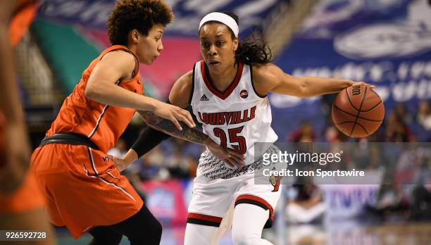 Louisville Cardinals guard Asia Durr drives during the ACC women's tournament game between the Virginia Tech Hokies and the Louisville Cardinals on...