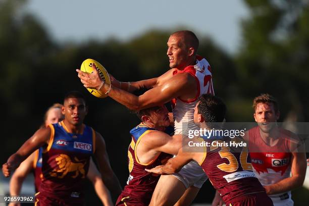 Sam Reid of the Swans handballs during the AFL JLT Community Series match between the Brisbane Lions and the Sydney Swans at Moreton Bay Central...